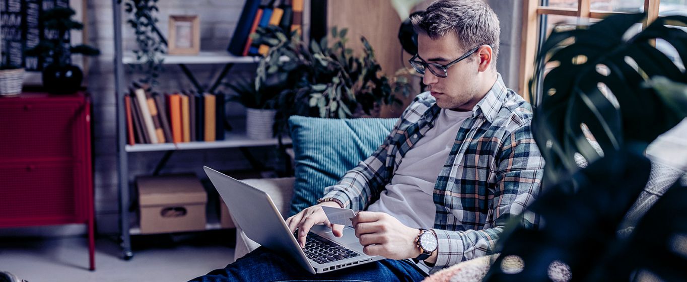 Man shopping online using a Visa credit card