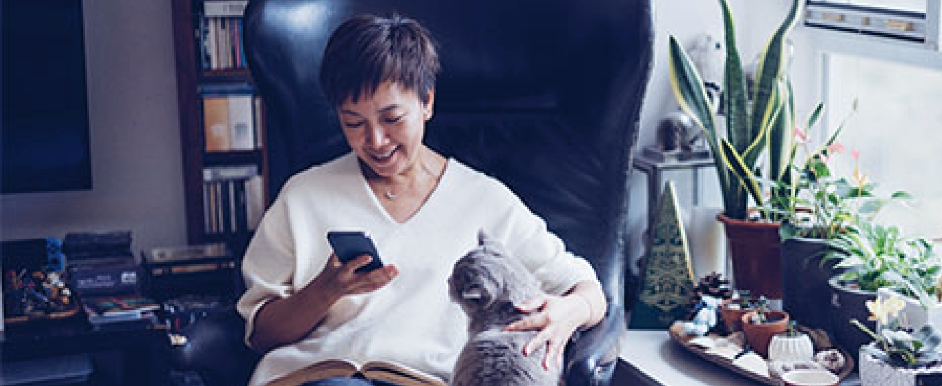 Woman banking on her mobile phone